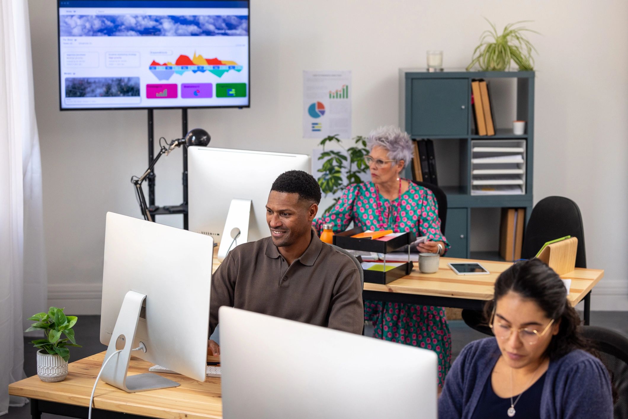 Software development team collaborating in a modern office